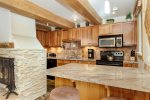 Fully equipped kitchen with granite countertops
